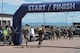 Two Airmen crossing finish line.