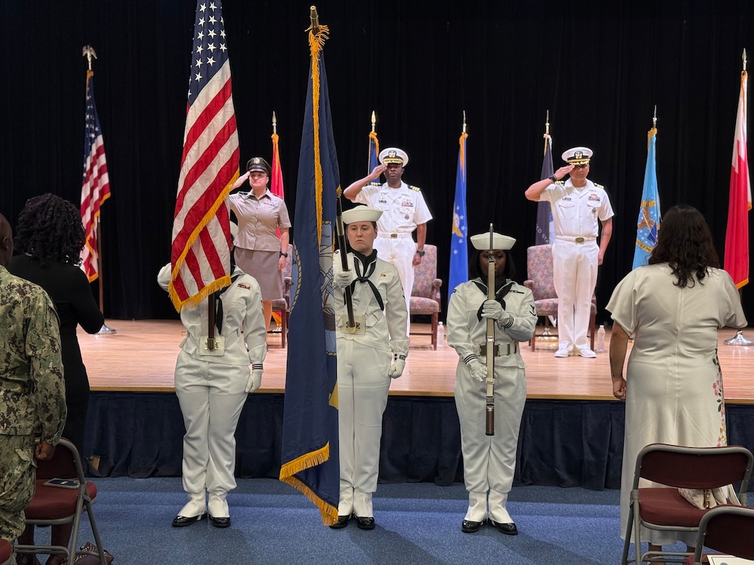 Naval Officers at a change of command at DLA Distribution Bahrain, Southwest Asia.