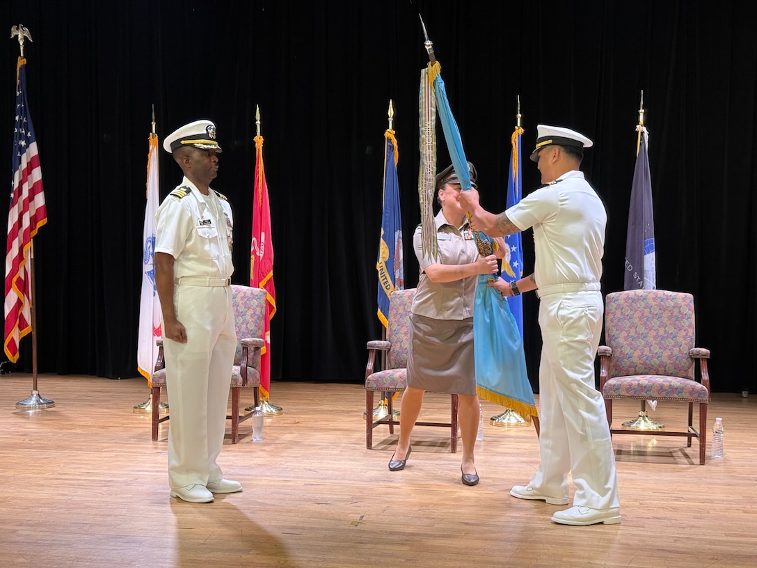 Naval Officers at a change of command at DLA Distribution Bahrain, Southwest Asia.