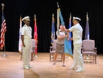 Naval Officers at a change of command at DLA Distribution Bahrain, Southwest Asia.