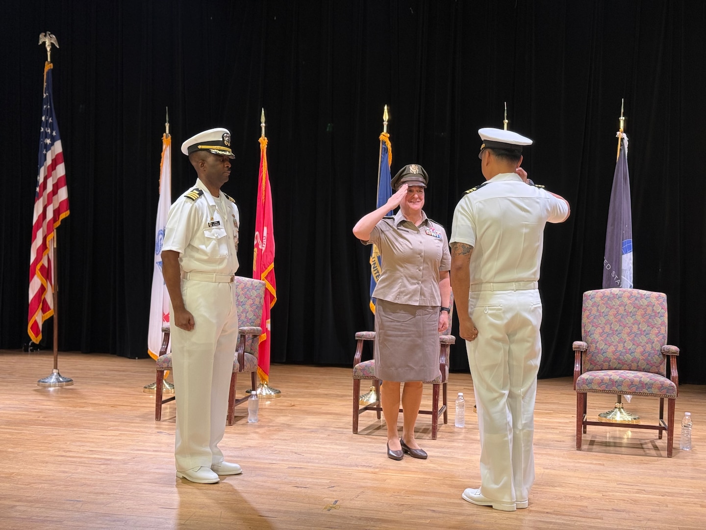 Naval Officers at a change of command at DLA Distribution Bahrain, Southwest Asia.