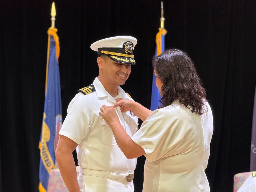 Naval Officers at a change of command at DLA Distribution Bahrain, Southwest Asia.