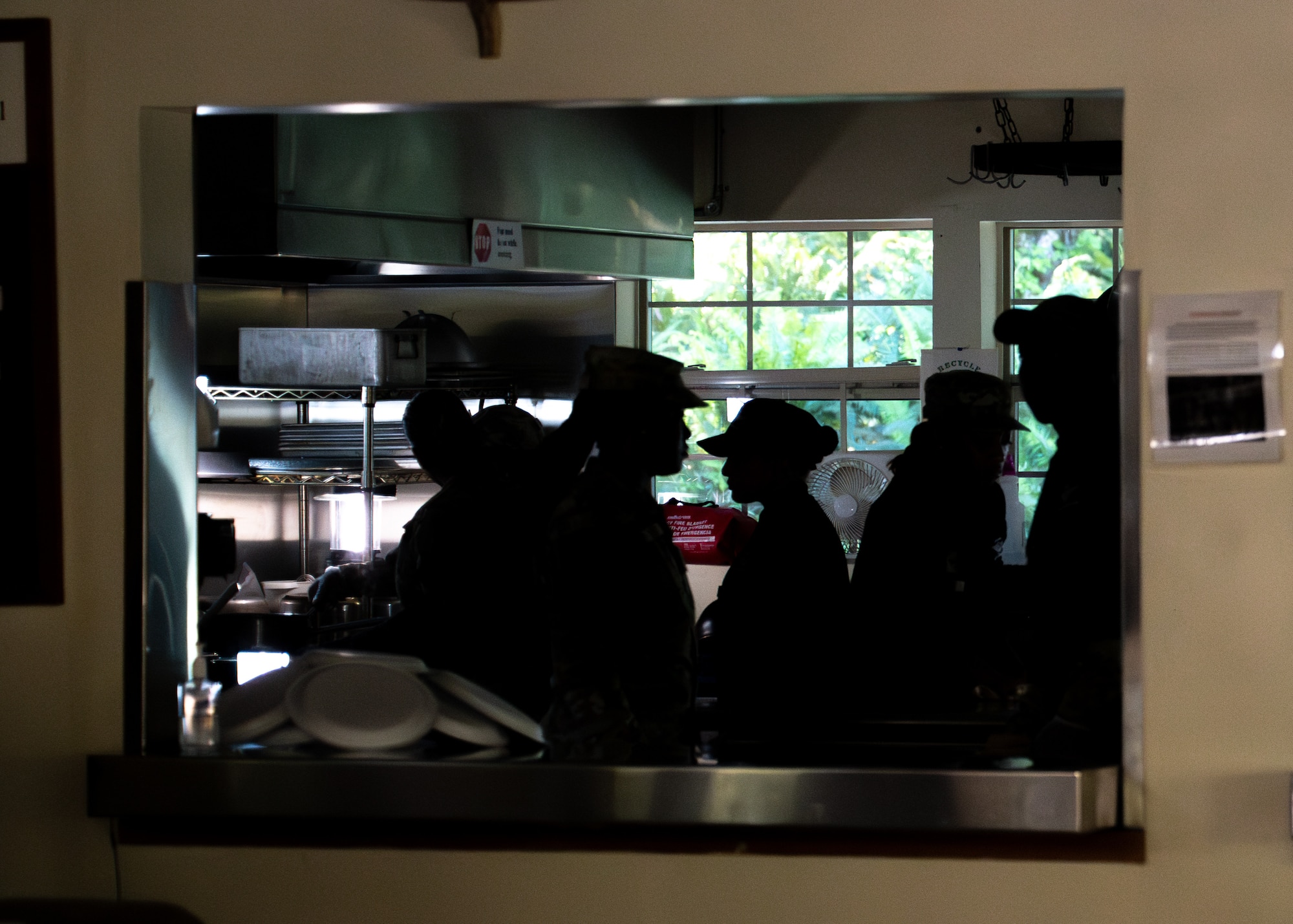 Airmen work together to prepare meal