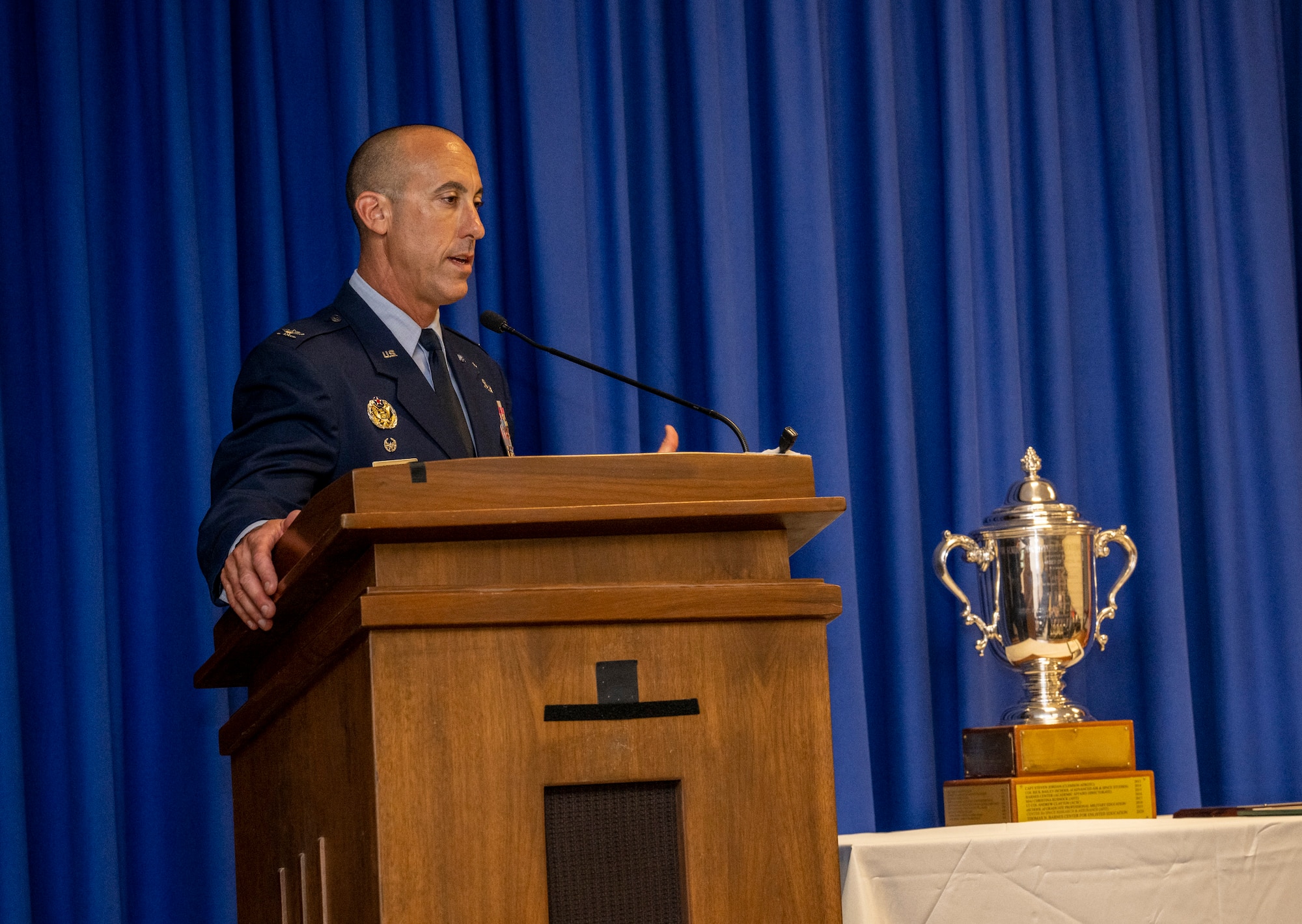 Col. Damian Schlussel, Thomas N. Barnes Center for Enlisted Education commander, gives remarks after the Barnes Center's Foundations Force Development Section received the 2024 General Muir S. Fairchild Educational Achievement Award during a ceremony on Maxwell Air Force Base, Alabama, June 11, 2025. (U.S. Air Force photo by Brian Ferguson)