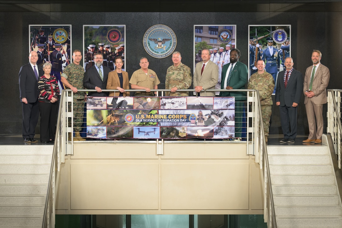 Attendees of the Marine Corps and DLA Service Integration Day gather for a group photo with Defense Logistics Agency Director Army Lt. Gen. Mark Simerly