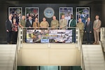 Attendees of the Marine Corps and DLA Service Integration Day gather for a group photo with Defense Logistics Agency Director Army Lt. Gen. Mark Simerly