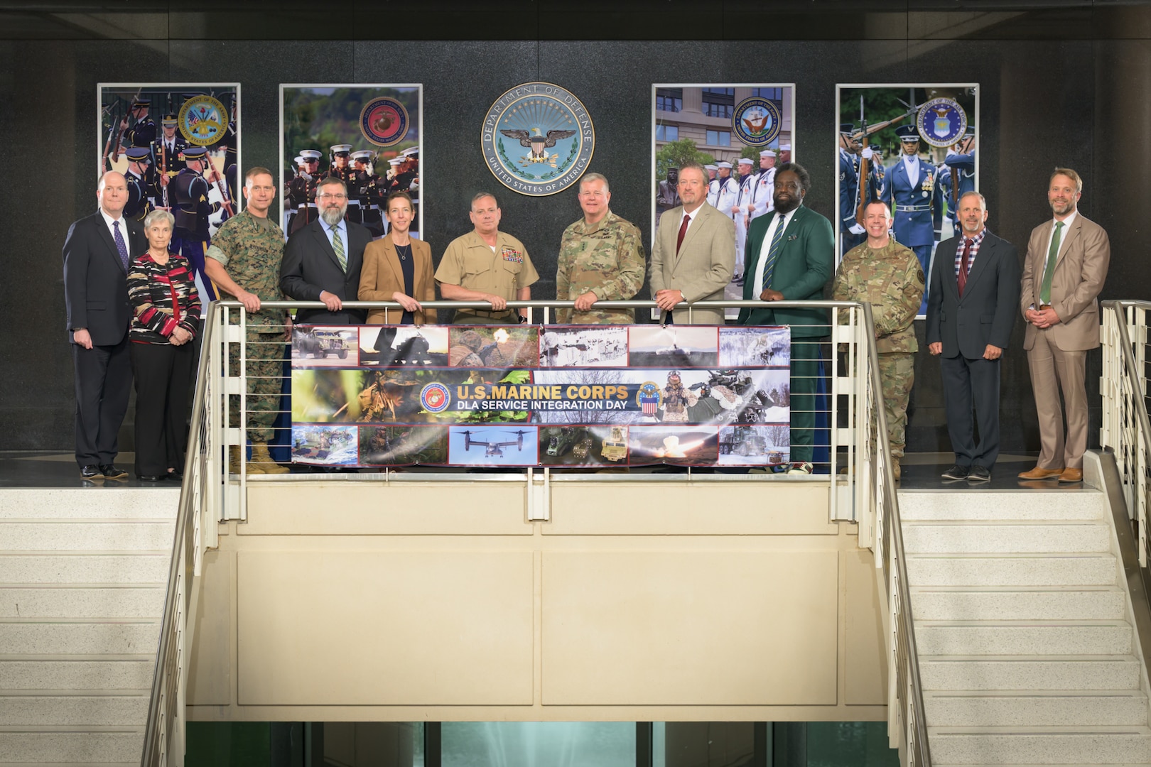 Attendees of the Marine Corps and DLA Service Integration Day gather for a group photo with Defense Logistics Agency Director Army Lt. Gen. Mark Simerly