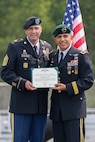 From left, Command Sgt. Maj. William Ferland, outgoing State Command Sergeant Major, New Hampshire National Guard, and Maj. Gen. David Mikolaities, Adjutant General for the NHNG, pose with the Legion of Merit certificate during his retirement ceremony, June 8, 2025, at the Edward Cross Training Complex, Pembroke, N.H.