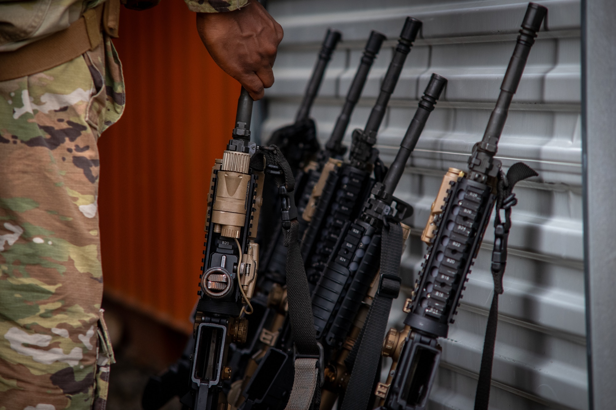 a person picks up a weapon