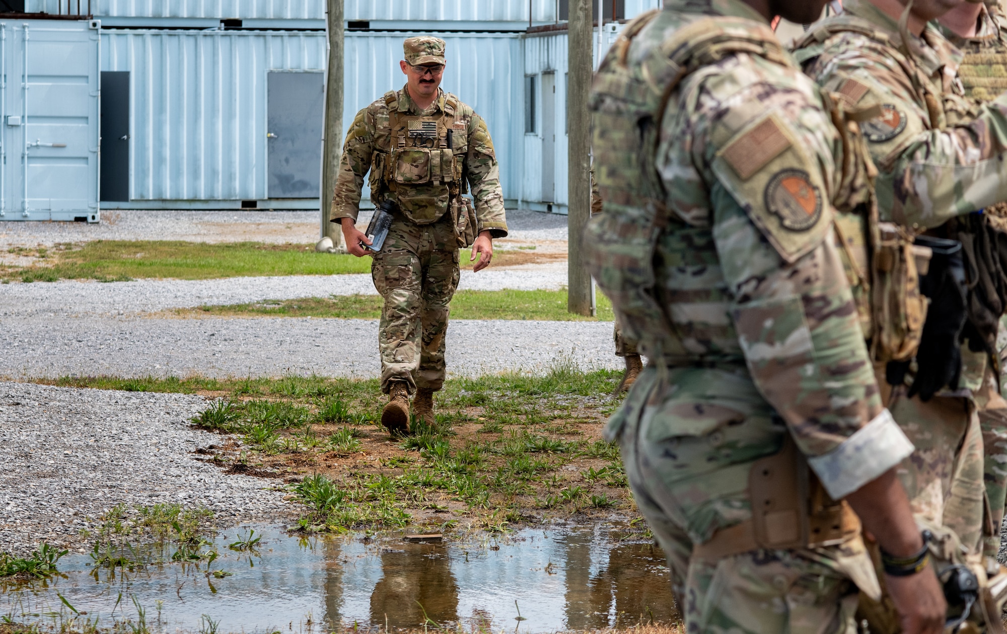 a person walks to a group