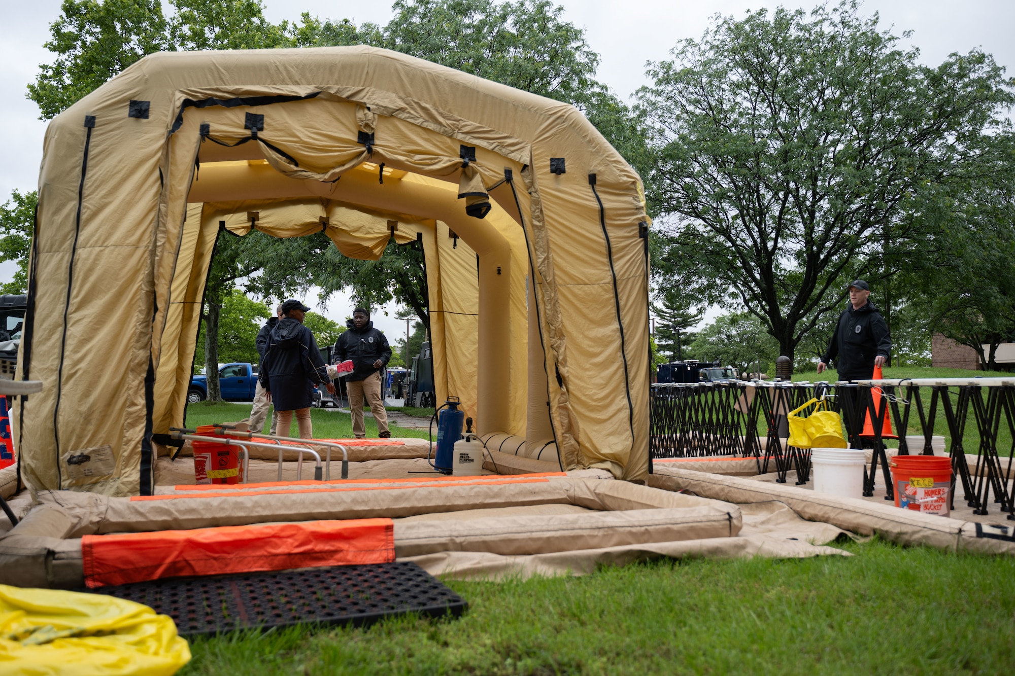 The 33rd Weapons of Mass Destruction Civil Support Team Survey Section simulate emergency doffing during a full-scale chemical, biological, radiological, nuclear and explosive exercise at Joint Base Andrews, Md., May 21, 2025.