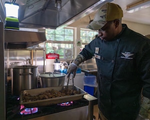 Airman prepares food