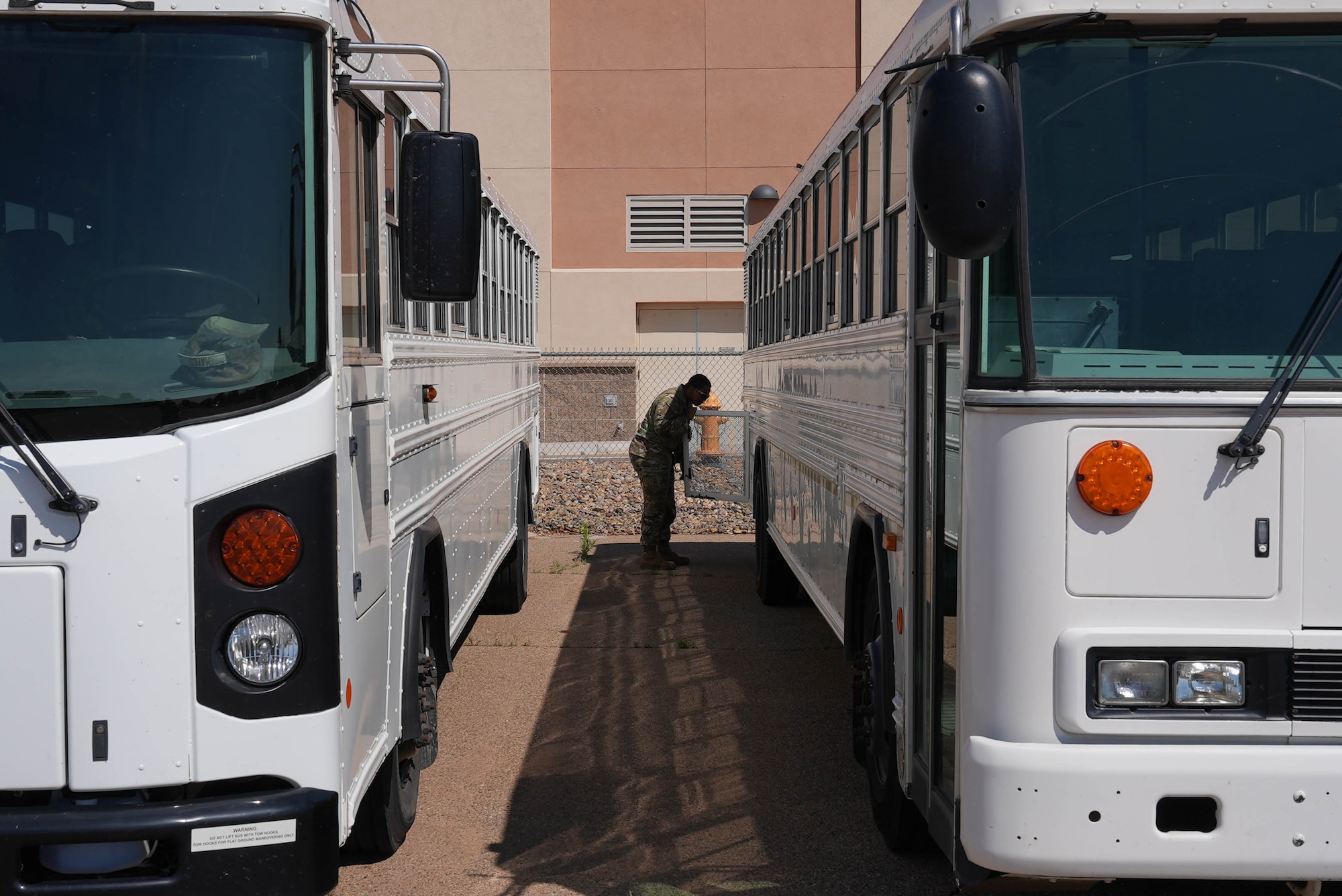 A ground transportation specialist assigned to the 27th Special Operations Wing inspects a bus at Cannon Air Force Base, New Mexico, June 4, 2025. Previously only able to certify ground transportation specialists on buses and tractor trailers, the commercial driver’s license program will now be open to any Airman across the wing whose duties would benefit from obtaining a CDL, and can be used for dump trucks, wreckers, forklifts, and numerous other vehicles. (U.S. Air Force photo by Staff Sgt. Kevin Williams)