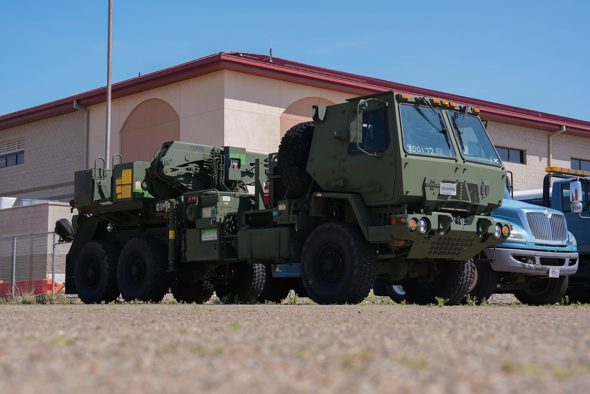 An M984 wrecker assigned to the 27th Special Operations Wing is parked in the motor pool at Cannon Air Force Base, New Mexico, June 4, 2025. Ground transportation specialists provide transportation services for distinguished visitors and special events, as well as investigating and clearing automobile accidents. (U.S. Air Force photo by Staff Sgt. Kevin Williams)
