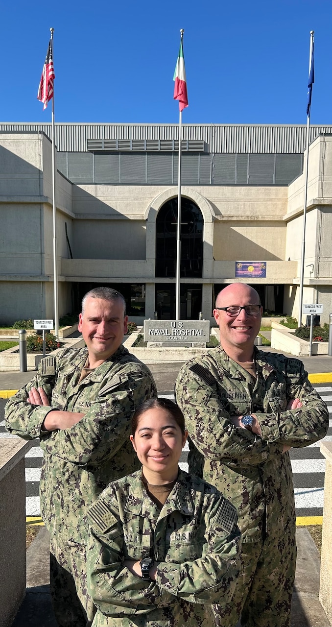 250611-N-TY711-5861 SIGONELLA, Italy (June 11, 2025). Lieutenant Commander Corey Housepian, Hospital Corpsman Second Class Mark Wear, and Hospitalman Kayden DeVilla, assigned to U.S. Navy Medicine Readiness and Training Command (NMRTC) Sigonella’s. They are the Command's Community Relations (Comrel) Team. Their efforts have significantly strengthened U.S. and Italian ties and bolstered command morale through over 400 hours of volunteer service since October 2024. Their team embody the Navy’s Culture of Excellence by fostering connection, character, and community engagement. (U.S. Navy photo by Lieutenant Commander Brandi Gibson)