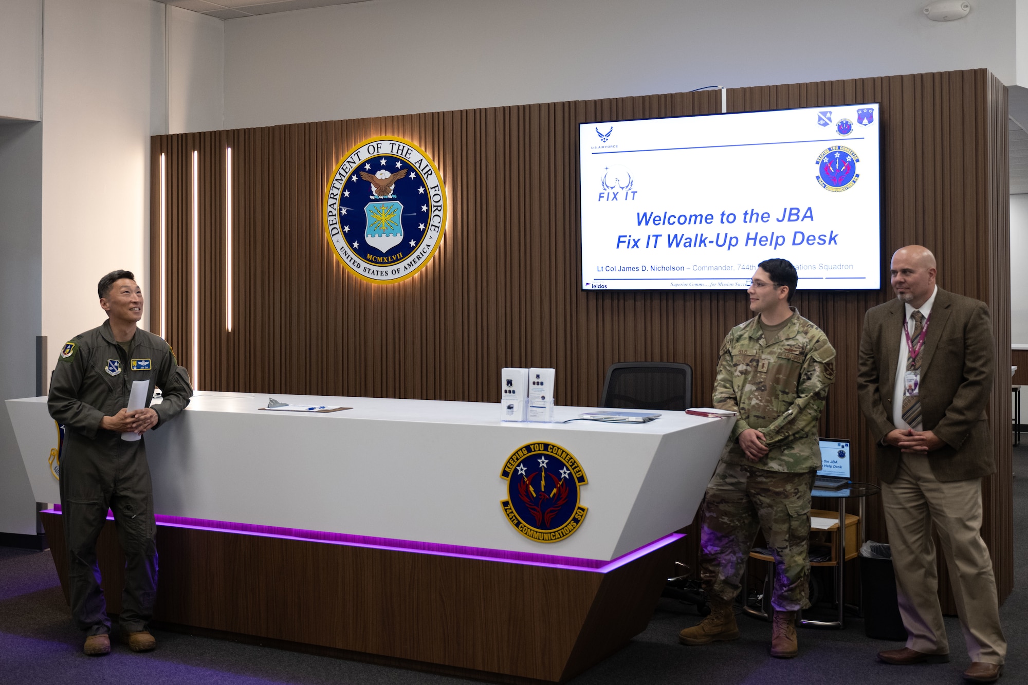 U.S. Air Force 2nd Lt. Diego Solis, center, leads a tour of the Fix IT building at Joint Base Andrews, Md., May 27, 2025. The building’s help desk was created by the same designers that worked on the Apple store fronts to create a welcoming and modern environment, taking inspiration from their clean lines, open layouts, and emphasis on user experience. (U.S. Air Force photo by Airman 1st Class Patrick Njuguna)