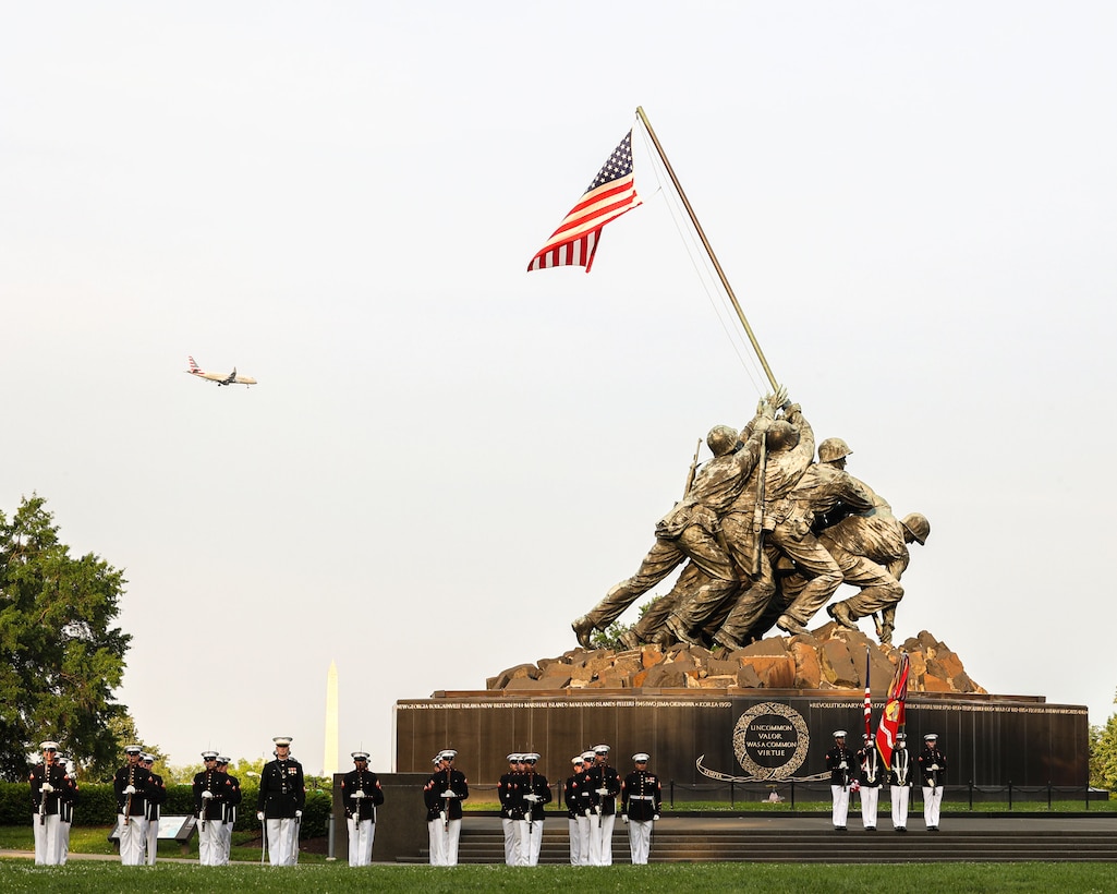 U.S. Marines with Marine Barracks Washington conduct the Tuesday Sunset Parade at the Marine Corps War Memorial, Arlington, Virginia, June 10, 2025. The evening’s parade was hosted by U.S. Marine Corps Maj. Gen. William L. Bowers in honor of Representative Robert Wittman of Virginia's 1st Congressional District. (U.S. Marine Corps photo by Lance Cpl. Brynn L. Bouchard)