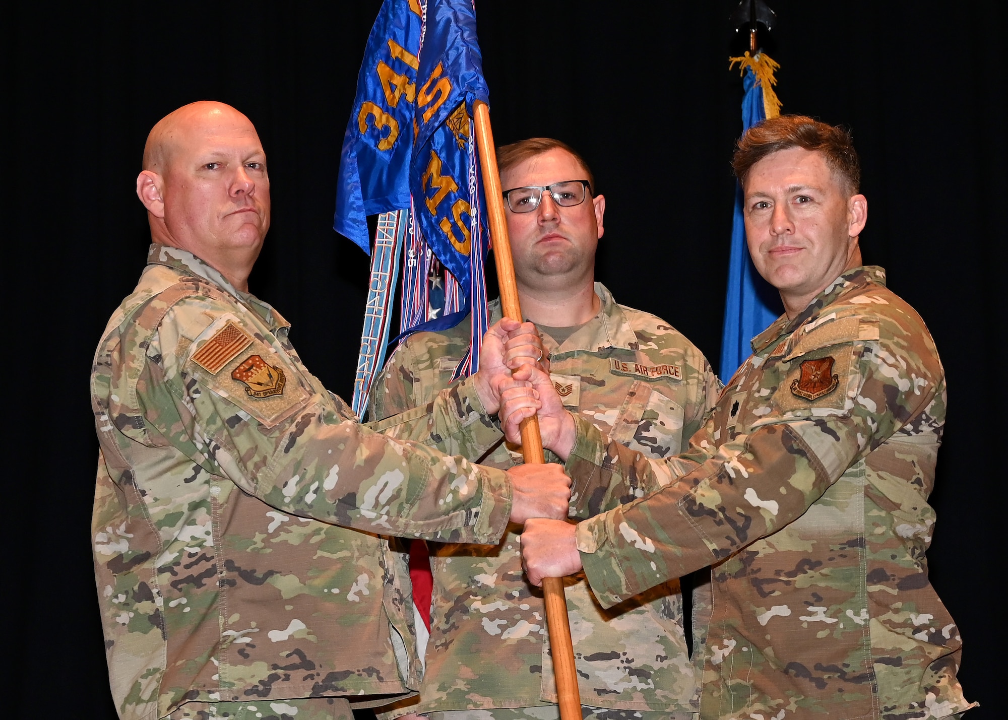 Group commander hands guideon to new squadron commander