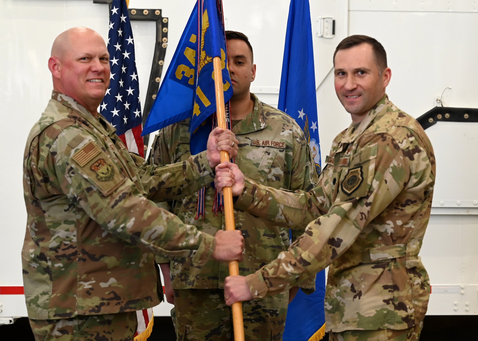 Group commander passing the guideon to the new squadron commander
