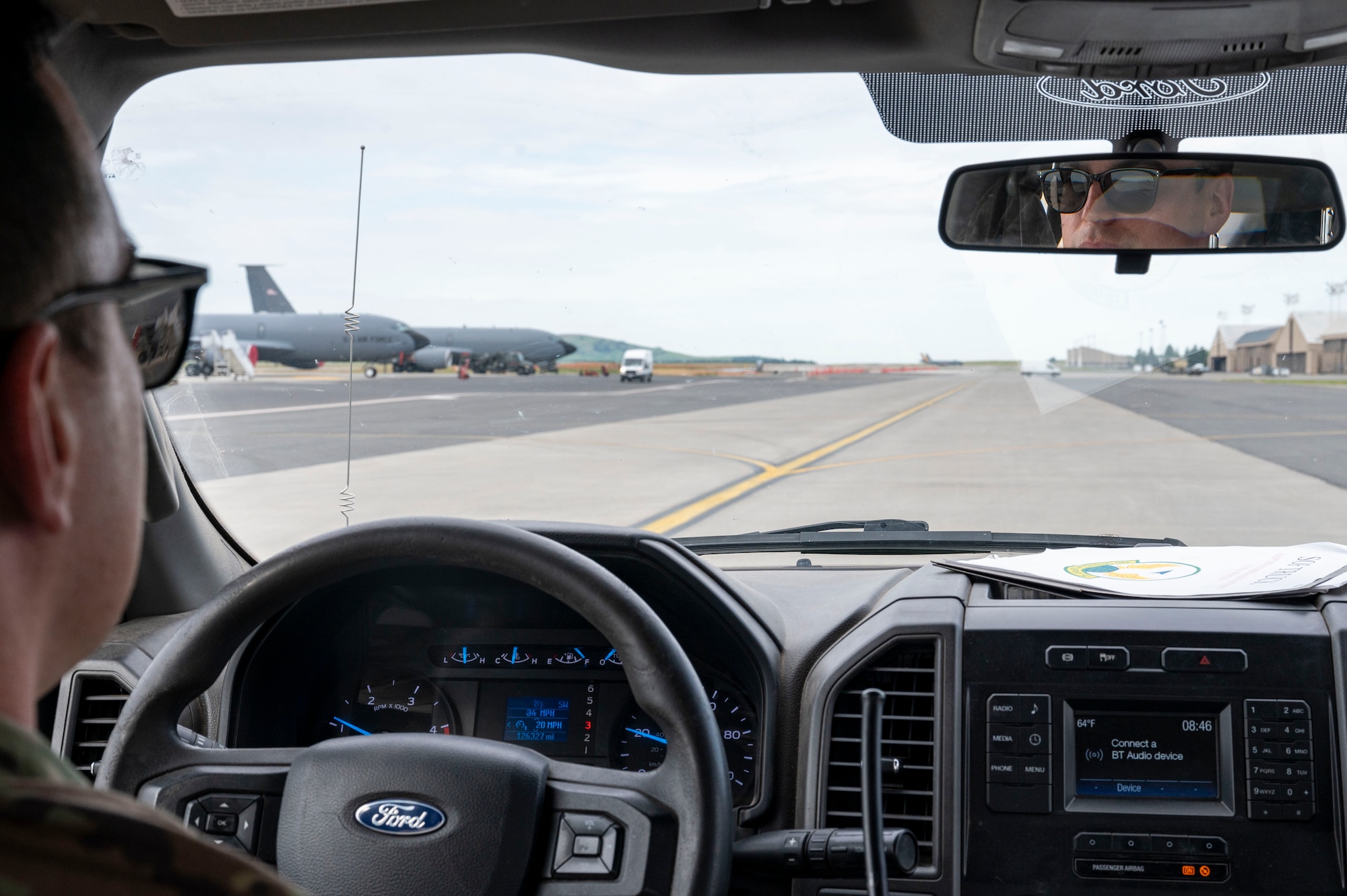 An Airman drives on the flightline.