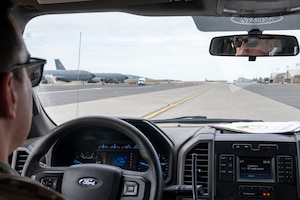 An Airman drives on the flightline.