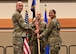 Group commander handing the squadron guideon to the new squadron commander