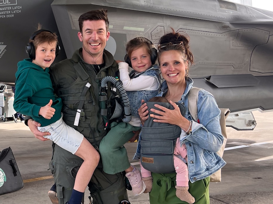 Royal Netherlands Air Force Maj. Rolandus Scherders (left), RNLAF 312th Squadron director of operations, and his family pose for a photo in front of an F-35 Lightning II on his first day of pilot training at Luke Air Force Base, Arizona.