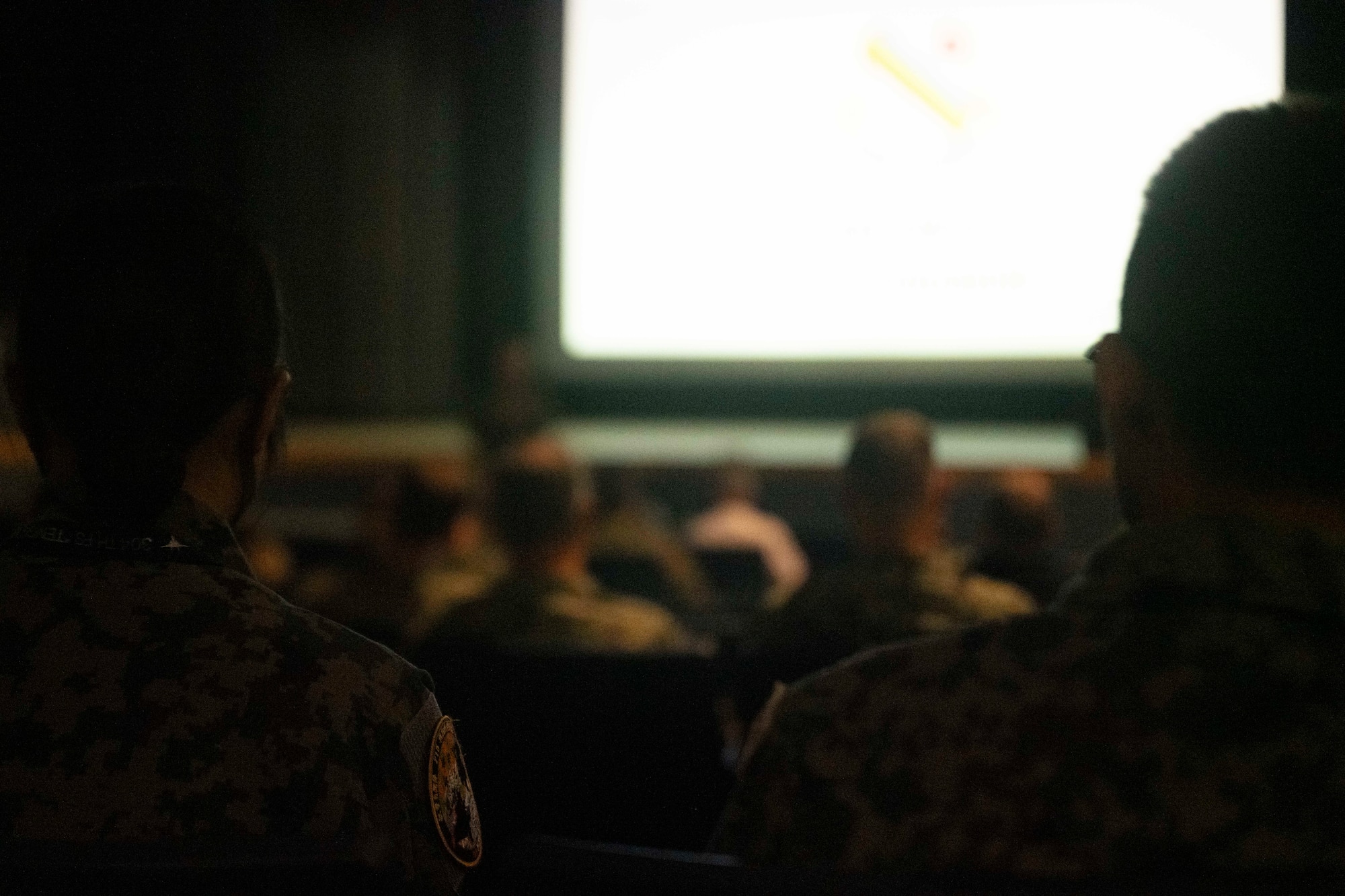 Japanese Air Self-Defense Force members sit during the Red Flag-Alaska welcome brief at Eielson Air Force Base, Alaska, June 12, 2025.