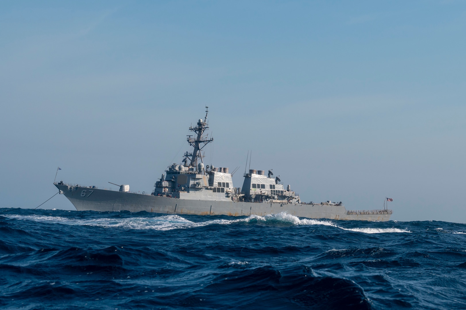 Arleigh Burke-class guided missile destroyer USS Cole (DDG-67) moors off the coast of Charleston, South Carolina, April 15, 2025 during Exercise Southern Lightning. For the exercise, Naval Information Warfare Center Atlantic tested several pieces of equipment as part of their routine scientific mission to enhance the interoperability and performance of various naval communications system configurations and capabilities. (U.S. Air Force photo by Staff Sgt. Emily Farnsworth) [Stock Photo]