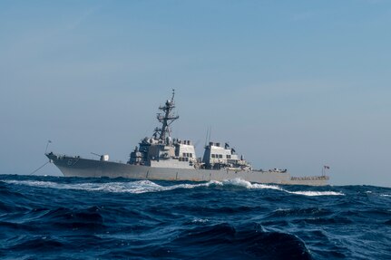 Arleigh Burke-class guided missile destroyer USS Cole (DDG-67) moors off the coast of Charleston, South Carolina, April 15, 2025 during Exercise Southern Lightning. For the exercise, Naval Information Warfare Center Atlantic tested several pieces of equipment as part of their routine scientific mission to enhance the interoperability and performance of various naval communications system configurations and capabilities. (U.S. Air Force photo by Staff Sgt. Emily Farnsworth) [Stock Photo]