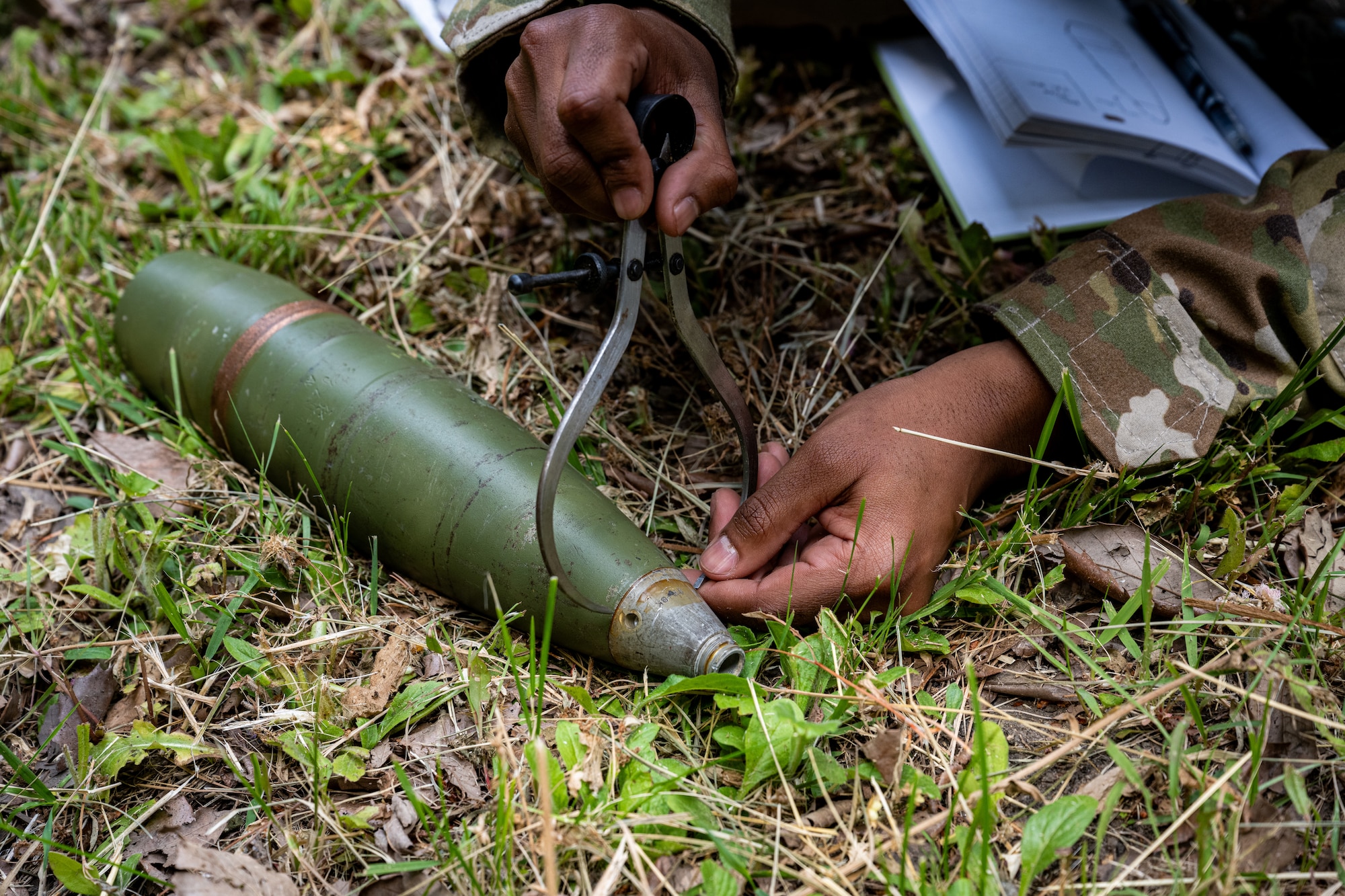 U.S. Air Force Airman 1st Class Burhan Ali, 35th Civil Engineer Squadron explosive ordnance disposal (EOD) team member, conducts a counter unexploded ordnance training demonstration to Japan Air Self-Defense Force Tohoku EOD school students  at Misawa Air Base, Japan, June 11, 2025.