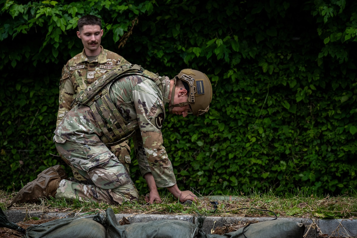 U.S. Air Force Airman 1st Class Benjamin Eagle, 35th Civil Engineer Squadron explosive ordnance disposal (EOD) team member,  conducts a counter unexploded ordnance training demonstration for Japan Air Self-Defense Force Tohoku EOD school students  at Misawa Air Base, Japan, June 11, 2025.