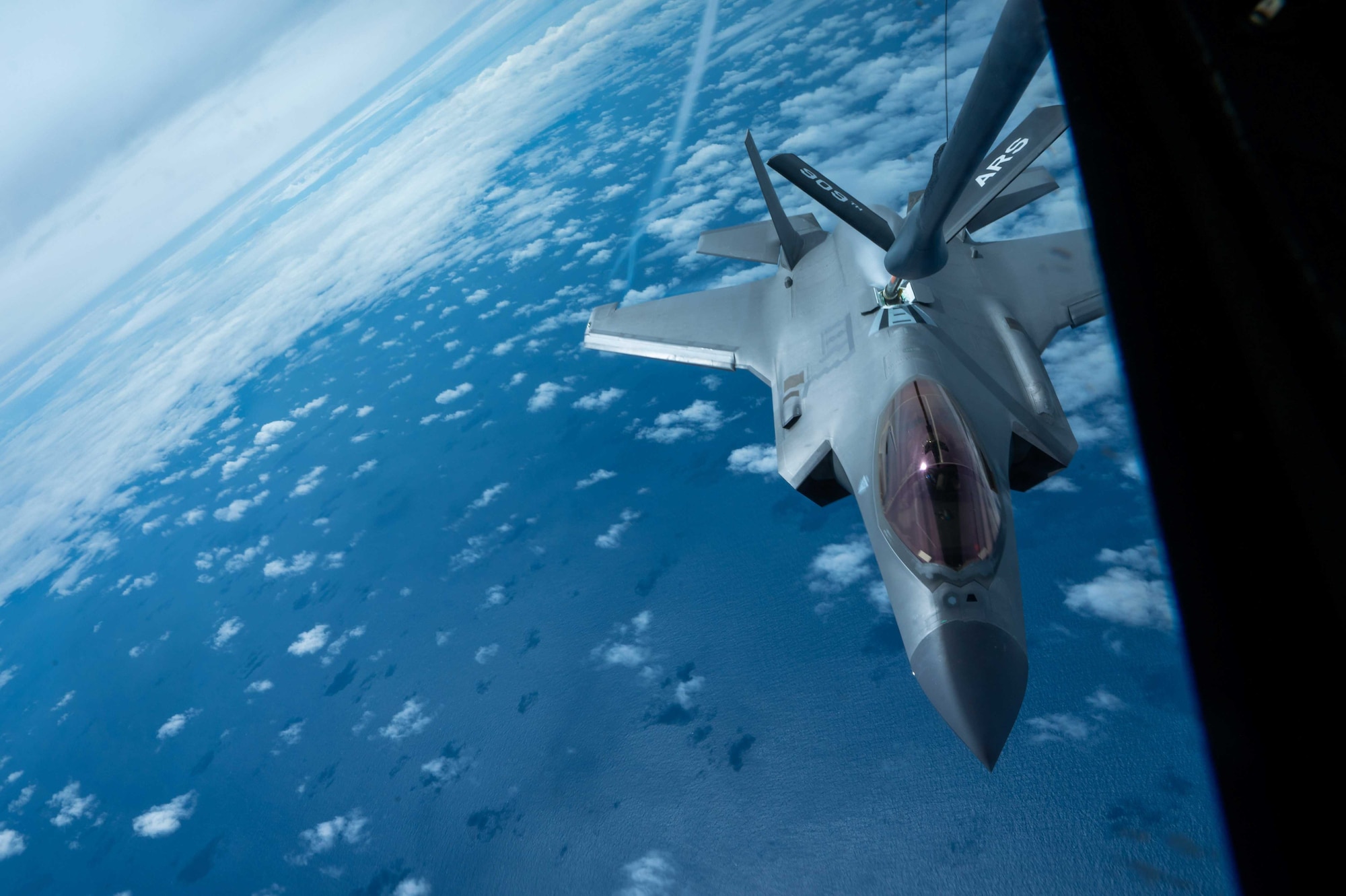 A F-35A Lightning II aircraft gets refueled by a KC-135 Stratotanker