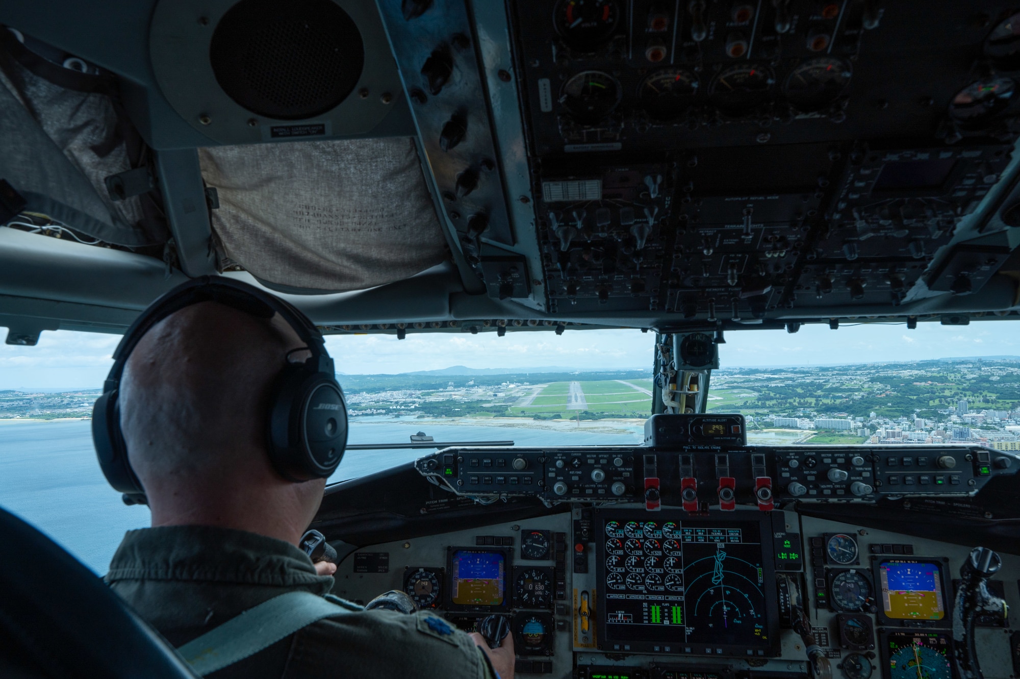 Military pilot sits in the cockpit of a KC-135 Stratotanker
