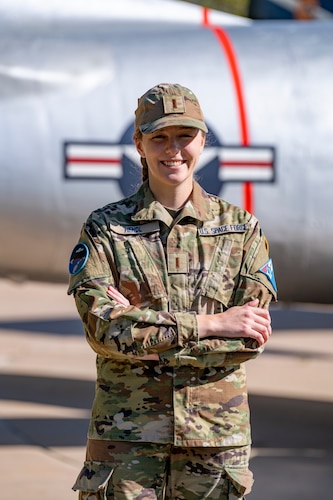 Guardian standing outside of plane tail