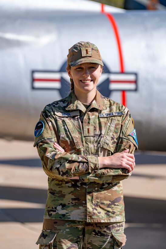 Guardian standing outside of plane tail