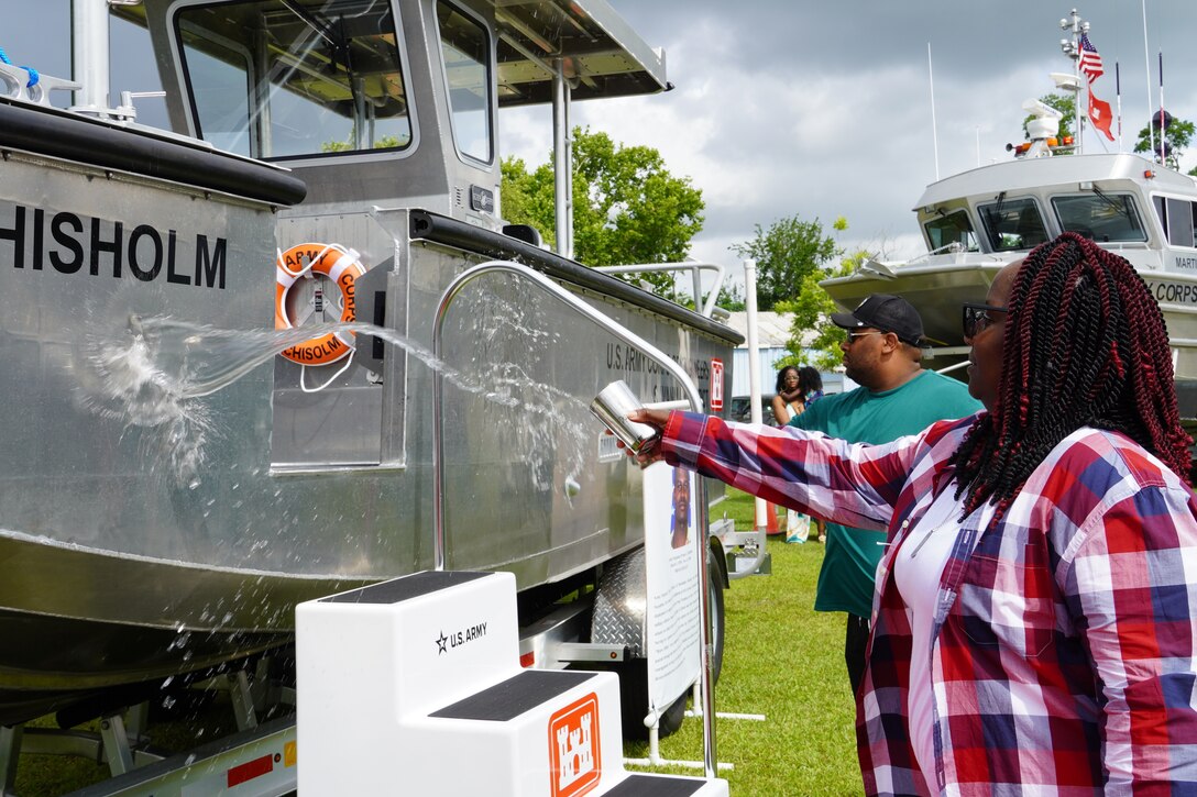 Family members of Sgt. Tyrone Chisholm douse water across the bow of the S/V Chisholm during a dedication ceremony, June 12, 2025, at the U.S. Army Corps of Engineers, Savannah District’s Engineers Depot in Savannah, Georgia.