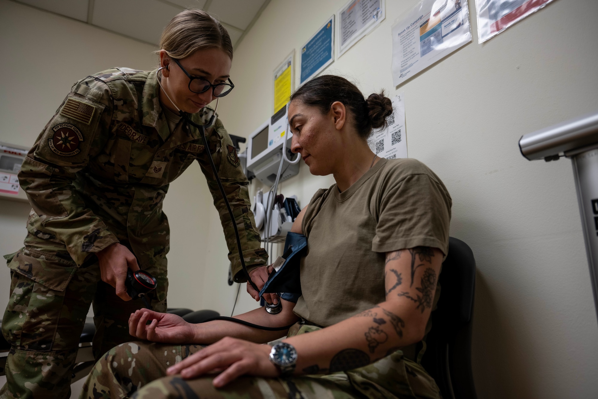 U.S. Air Force Staff Sgt. Wendy Updegrave, 8th Operational Medical Readiness Squadron noncommissioned officer in charge of the operational medicine cell, takes the blood pressure of an Airman at Kunsan Air Base, Republic of Korea, June 13, 2025.