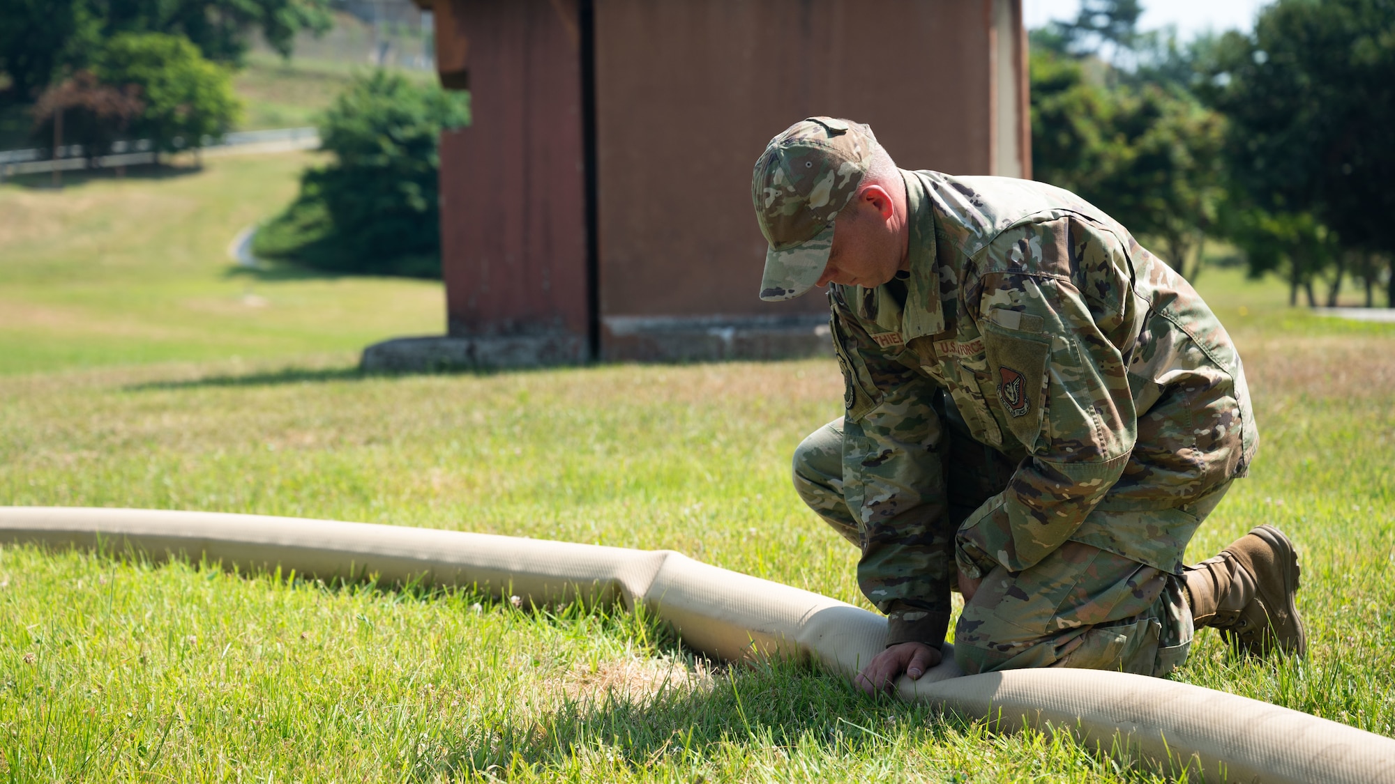 U.S. Air Force Tech. Sgt. Louis Thiele, 51st Civil Engineer Squadron section chief of liquid fuels maintenance, monitors a fuel line at Osan Air Base, Republic of Korea, June 11, 2025. The Water and Fuel Expedient Repair System demonstration is the first training on Osan consisting of Airmen from both the 51st CES and the 51st Logistics Readiness Squadron. The hydraulic driven pump transfers fuel from a well to the WaFERS pump trailer, flowing fuel through lines to get filtered into the refuelling truck. (U.S. Air Force photo by Senior Airman Rome Bowermaster)