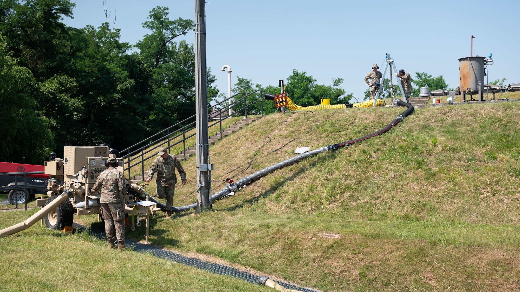 U.S. Air Force Airmen assigned to the 51st Civil Engineer Squadron operate and oversee the Water and Fuel Expedient Repair System at Osan Air Base, Republic of Korea, June 11, 2025. The WaFERS system demonstration is the first training on Osan consisting of Airmen from both the 51st CES and the 51st Logistics Readiness Squadron. The hydraulic driven pump transfers fuel from a well to the WaFERS pump trailer, flowing fuel through lines to be filtered into the refuelling truck. (U.S. Air Force photo by Senior Airman Rome Bowermaster)