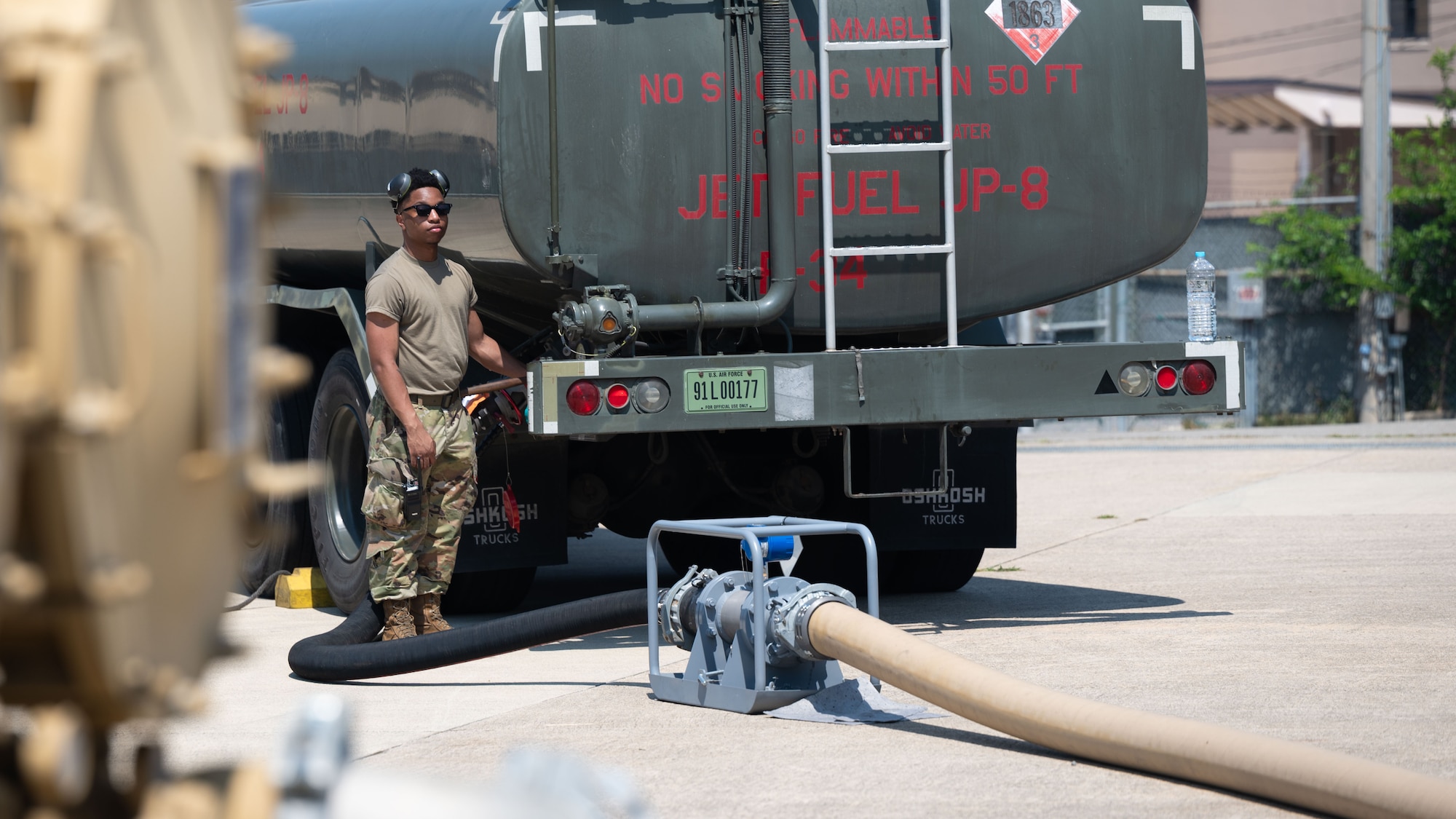 U.S. Air Force Airman 1st Class Duquan Glenn, 51st Logistics Readiness Squadron fuel distributors operator, secures a fuel line at Osan Air Base, Republic of Korea, June 11, 2025. The Water and Fuel Expedient Repair System demonstration is the first training on Osan consisting of Airmen from both the 51st Civil Engineer Squadron  and the 51st LRS. The hydraulic driven pump, pumps fuel from well to the WaFERS pump trailer, flowing fuel through lines to be filtered into the refuelling truck. (U.S. Air Force photo by Senior Airman Rome Bowermaster)