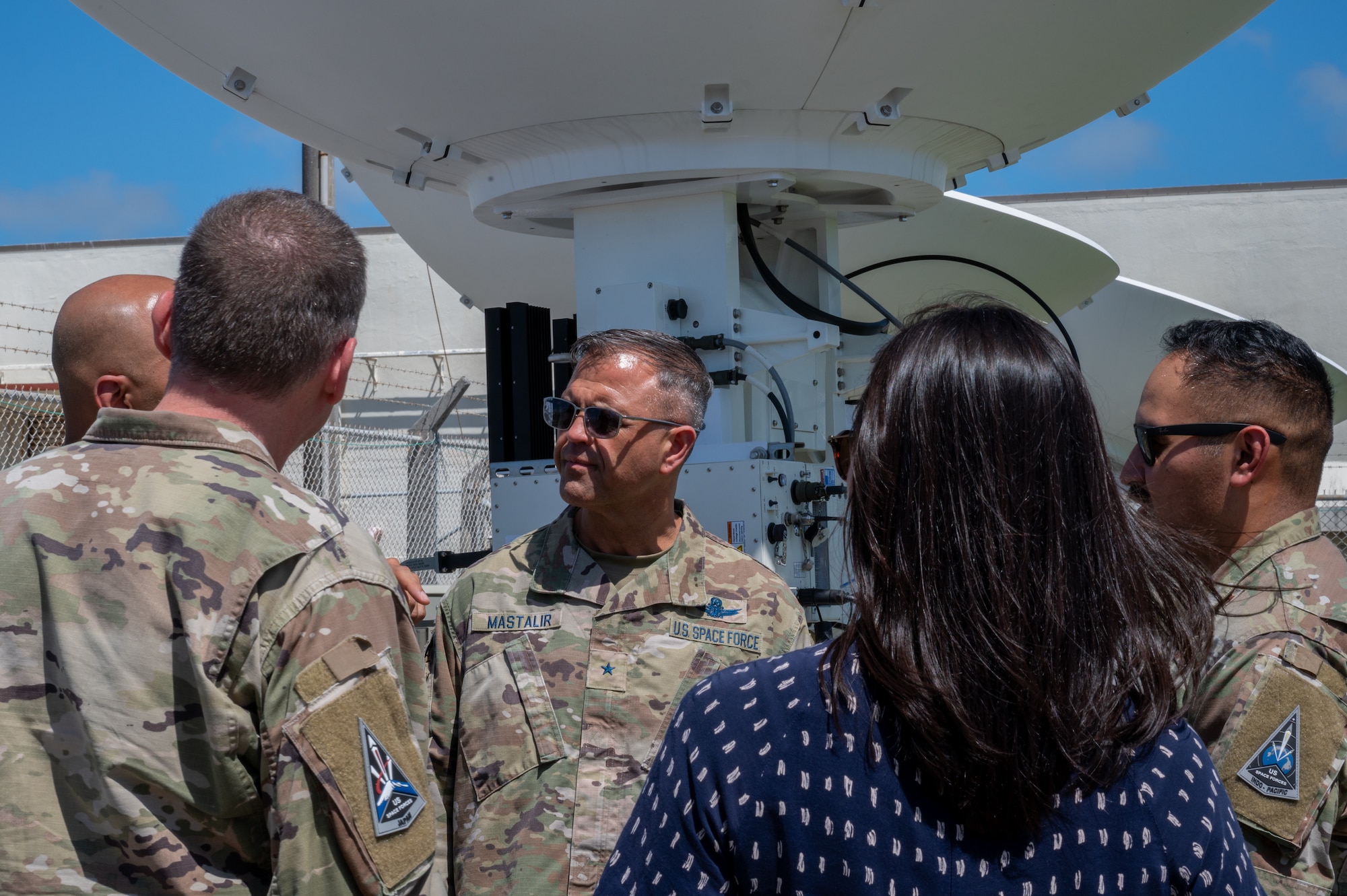 U.S. service members huddle around to talk