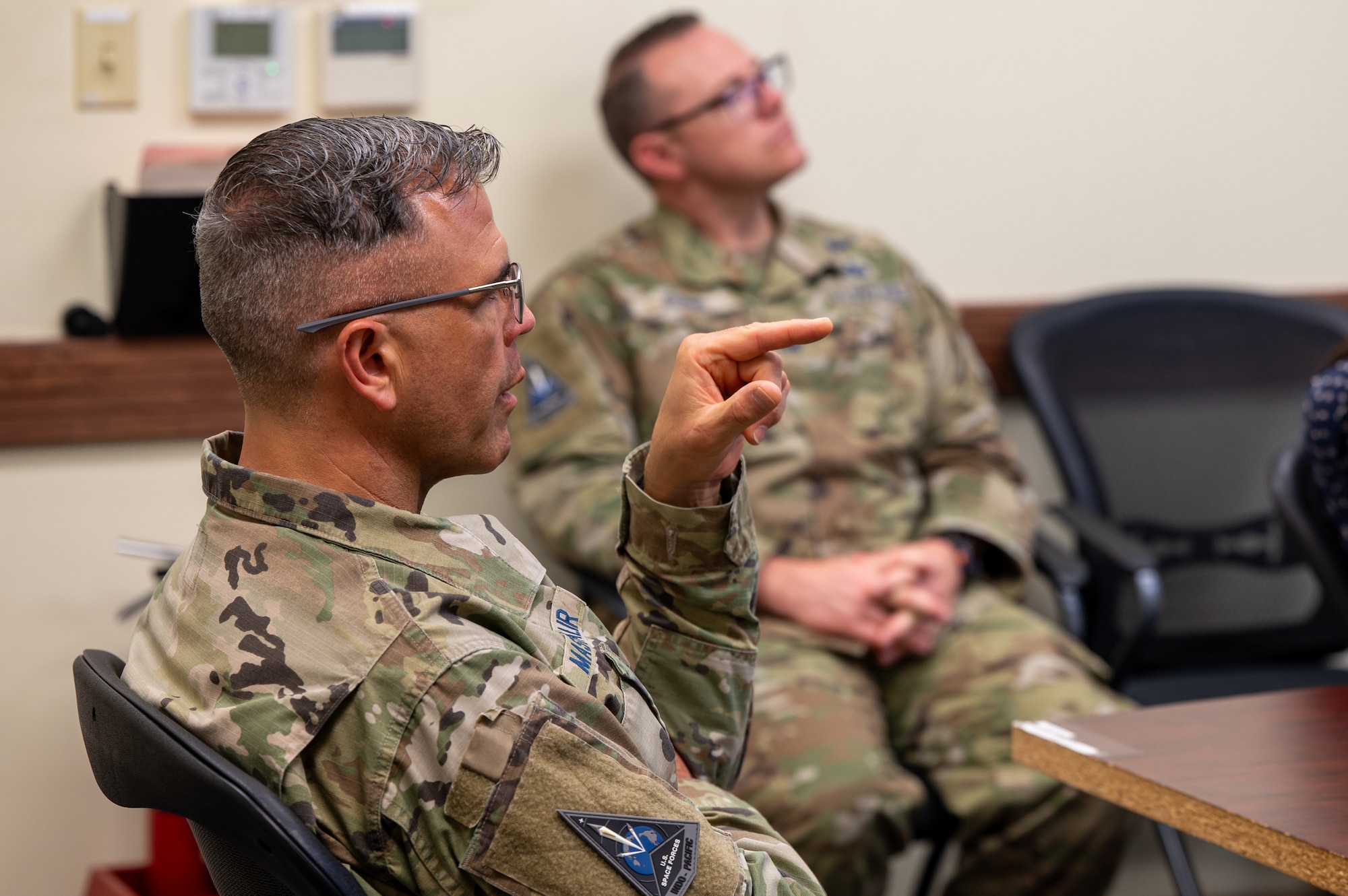 U.S. service member attends meeting