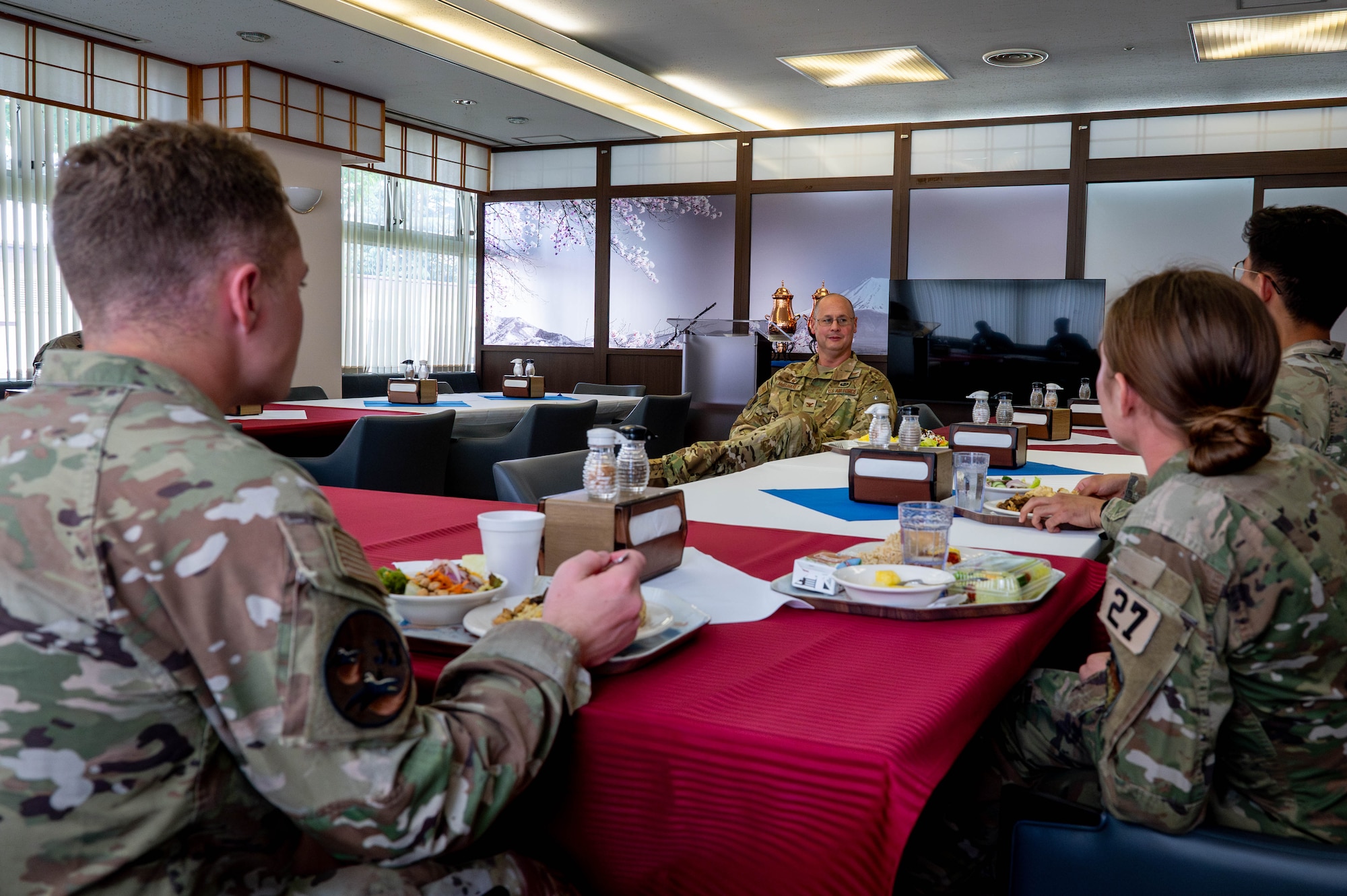 U.S. Air Force Col. Richard McElhaney, 374th Airlift Wing commander, speaks with cadets.