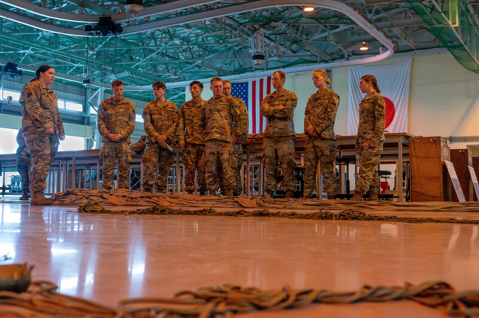 U.S. Air Force Airman 1st Class Tori Myers, 374th Logistics Readiness Squadron combat mobility operations technician, left, speaks with USAFA cadets.