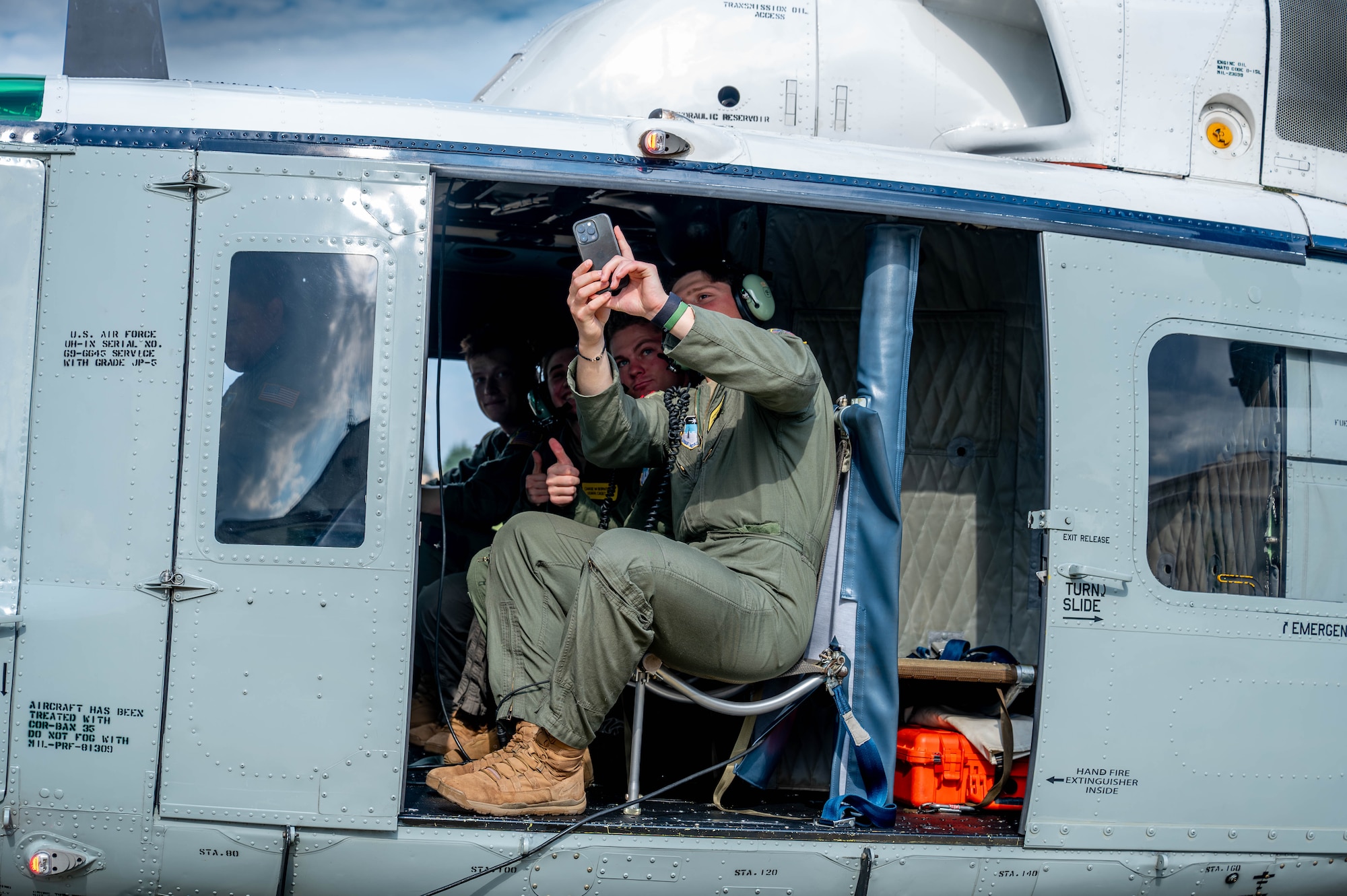 U.S. Air Force Academy cadets take a photo on a UH-1N Huey.