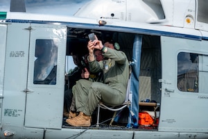 U.S. Air Force Academy cadets take a photo on a UH-1N Huey.