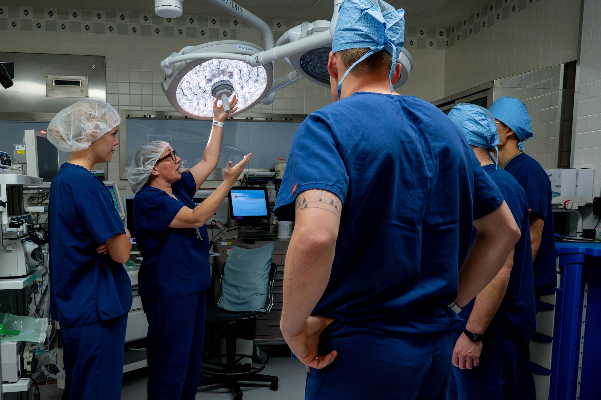 U.S. Air Force Maj. Lisa Paulson, 374th Medical Group surgical services director, shows U.S. Air Force Academy cadets an operating room.