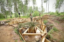 U.S. Navy Sailors assigned to Naval Construction Battalion 14 and Marines assigned to 8th Engineering Support Battalion conduct trench reinforcement training to increase combat engineering capabilities during exercise Baltic Operations 2025 (BALTOPS 25), June 6, 2025, in Skrunda, Latvia.