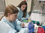 250513-N-N1574-1003 JACKSONVILLE, Fl. (May 13, 2025) Jessy Motes, front, and Jessica Celano, with the Navy Entomology Center of Excellence (NECE), prepare a DNA sequencing library to be loaded into a sequencer on board Naval Air Station Jacksonville, May 13, 2025, as part of a groundbreaking three-year project is utilizing common houseflies as living sentinels to monitor existing and emerging microbial dangers to U.S. military personnel worldwide. The NECE team demonstrates the Navy’s “Get Real, Get Better” ethos by leveraging science and collaboration to enhance force health protection through early detection of health threats. (U.S. Navy photo courtesy of Dr. Jason Blanton)